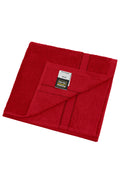 James & Nicholson Handtuch im dezenten Design orient-red